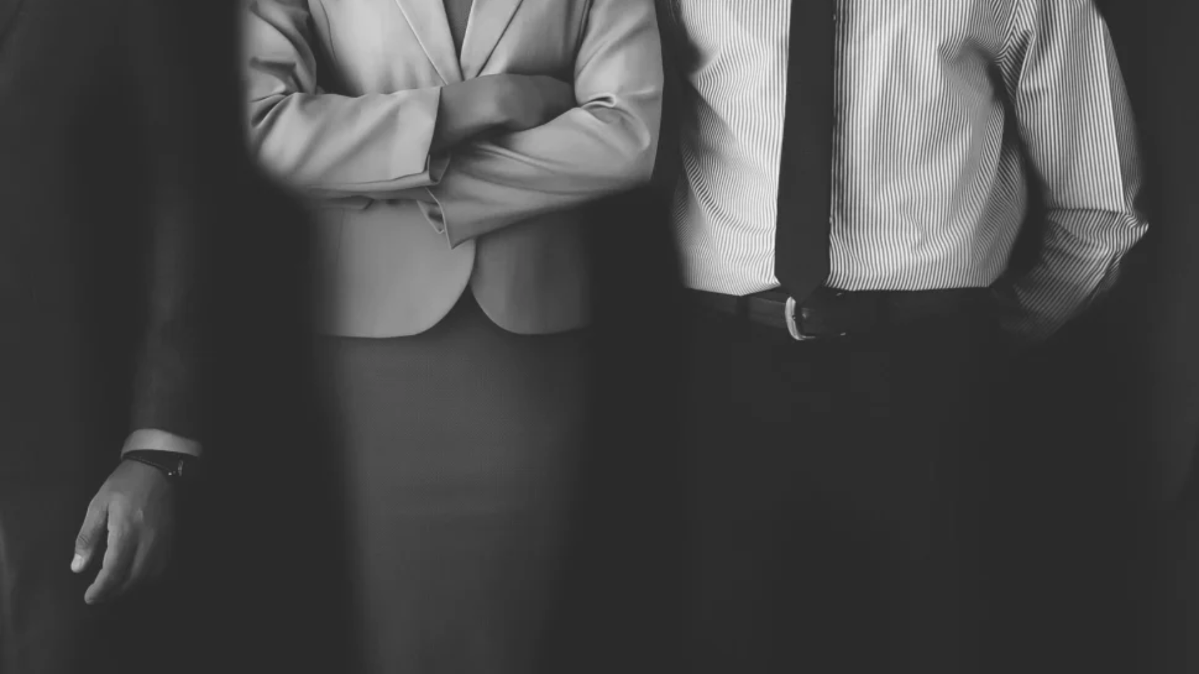 confident-business-people-standing-together-scaled-970x728