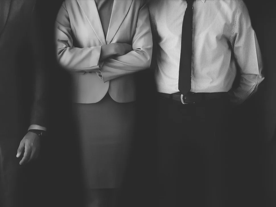 confident-business-people-standing-together-scaled-970x728